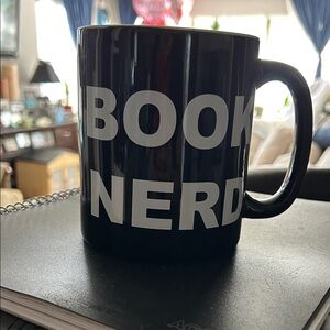 Black 'Book Nerd' Mug XL sat on shelf for a couple of years